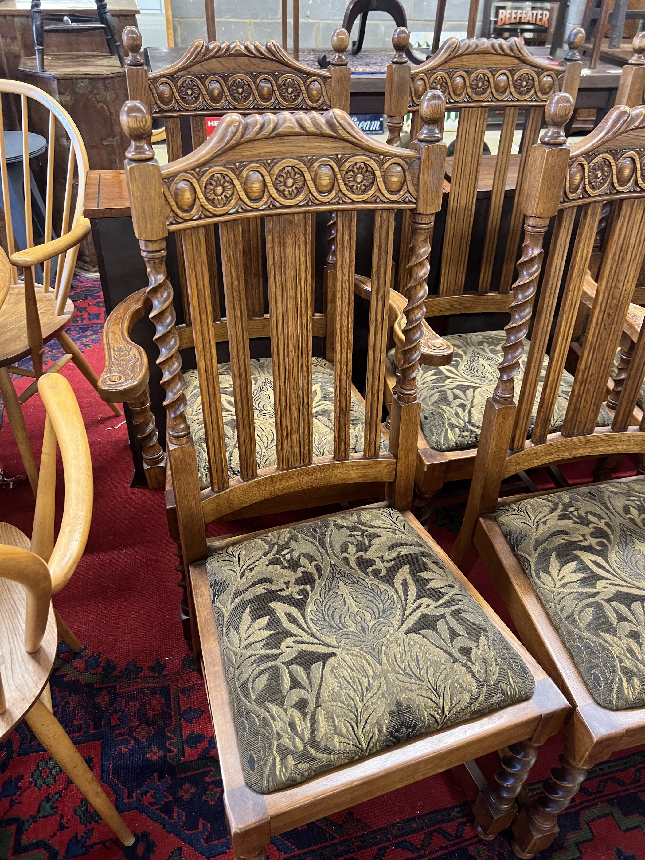 A set of six 1920's oak barley twist dining chairs, two with arms